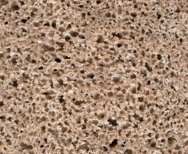 Esmer ekmeğin pürüzsüz dokusu arka plan olarak yakın plan