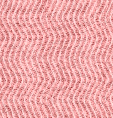 Arka plan olarak pürüzsüz pembe örülmüş tekstil dokusu