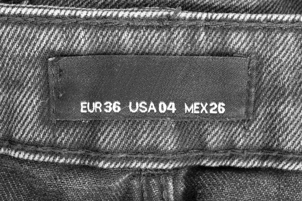 Etiqueta Ropa Tamaño Fondo Denim Negro Primer Plano — Foto de Stock