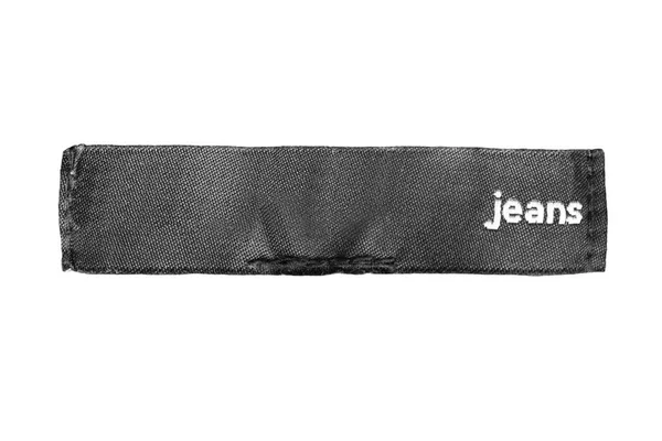 Textilní Oděvní Štítek Říká Džíny Izolované Přes Bílou — Stock fotografie