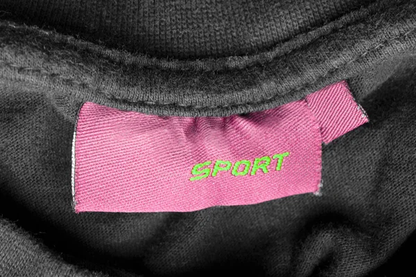 Рожева Марка Одягу Каже Спорт Чорному Текстильному Фоні — стокове фото
