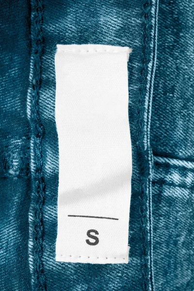 Etiqueta Ropa Talla Sobre Fondo Denim Azul — Foto de Stock