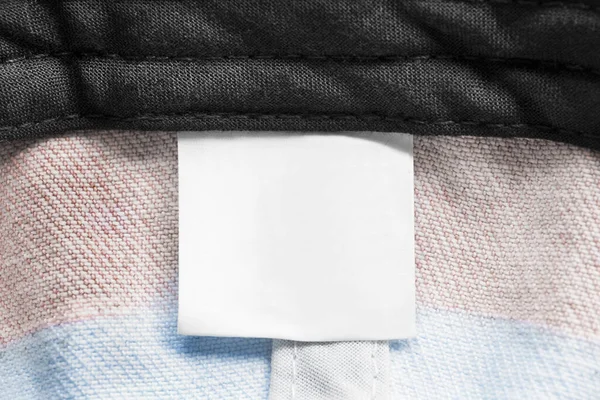 Pusta Etykieta Odzieży Tle Włókienniczym Zbliżenie — Zdjęcie stockowe