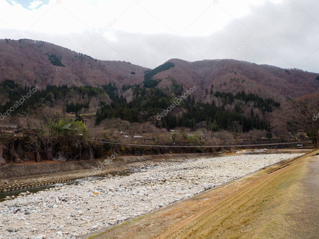 The beautiful river in Shirakawago flows through the gorge.
