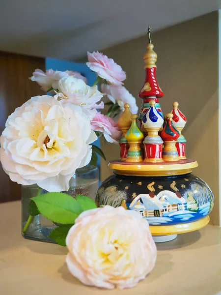 Roses and souvenirs from Russia in my living room