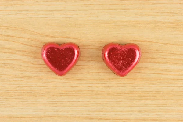 Chocolate candy red heart on wooden background. — Stock Photo, Image