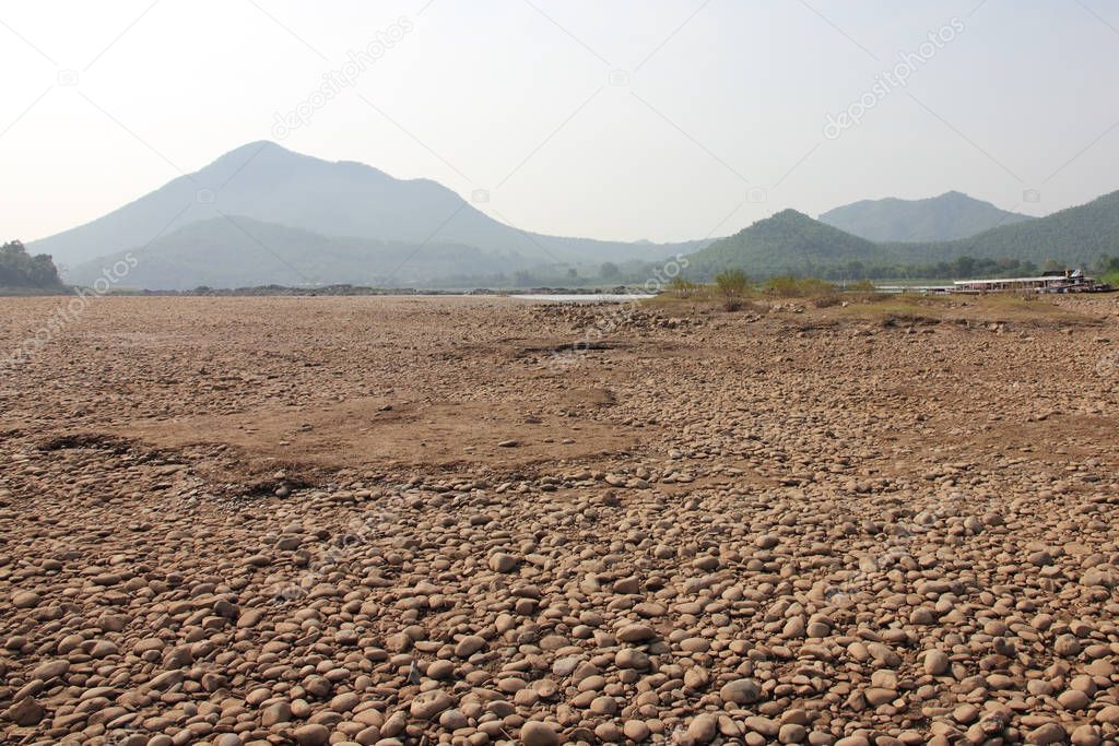 Gravel bed of the river bed with mountain