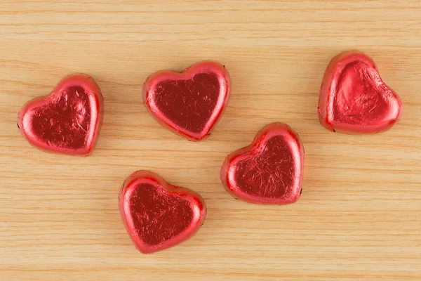 Chocolate candy red heart on wooden background. — Stock Photo, Image