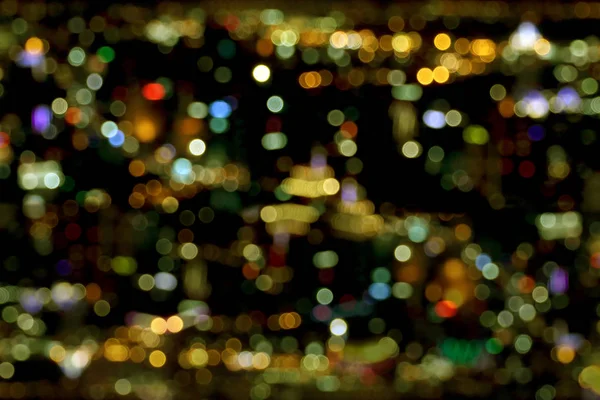 Blurred lights of bokeh from top view, city at night. — Stock Photo, Image