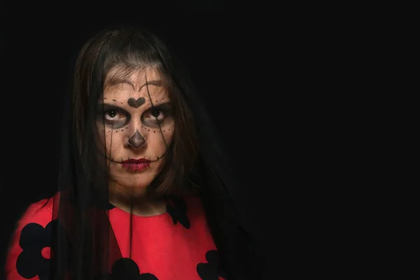 Hallowen ,woman with makeup on a black background with place for text