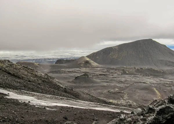 Dramatic landscape on volcanic formations and melting glacier on the background, Kverkfjoll, remote part of the central highlands of Iceland, Vatnajokull National Park, Europe