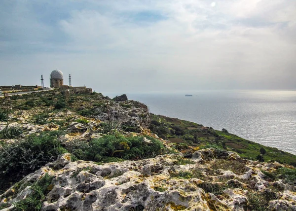 Radar station and Dingli cliffs and majestic views of the Mediterranean sea and the lush countryside, Malta, Europe