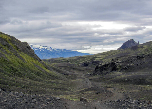 View on dramatic icelandic terrain with Eyjafjallajokull volcano, canyons, glacial rivers, highland deserts and poor vegetation, on the Laugavegur Trail from Thorsmork to Landmannalaugar, Iceland