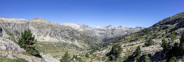 Panoramic view of mountain landscape of Pyrenees mountain range near the town of Cauterets, National park Pyrenees in beautiful summer sunny day with blue sky, France, Europe