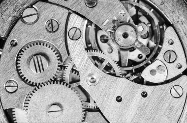 Gears old mechanical watches. Pendulum, cogs under the hood. Close up view, selective focus.Black and white clipart