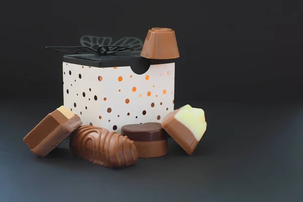 Various chocolates and a gift box