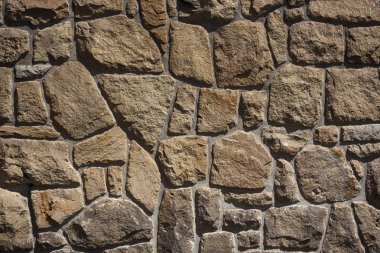 Cyclop taş duvar, düz arka plan ve doku - kaba taş yüzey yığılmış