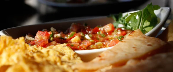 tortilla with tomato salsa close up