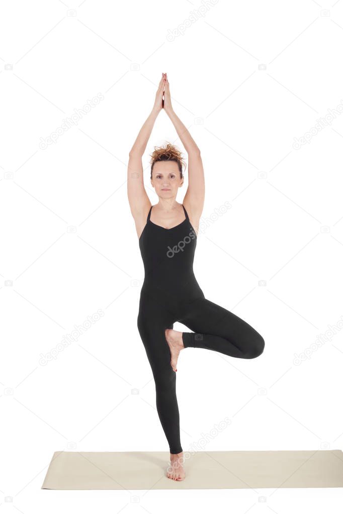 Beautiful Yoga: Vrikshasana - Real senior woman doing The Tree Pose exercise