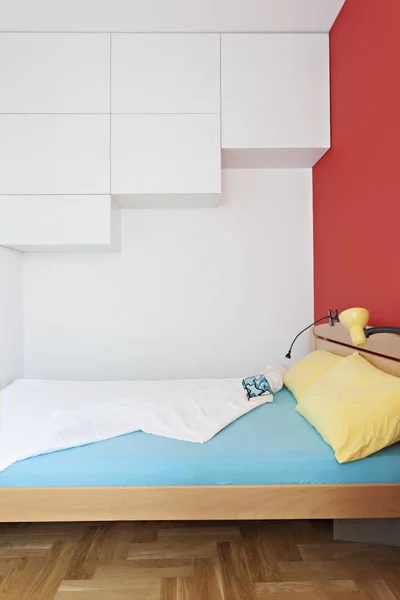 Cozy modern colorful bedroom interior with bed sheet and geometry shapes design