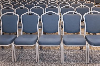 Empty blue chairs in conference hall - presentation room  clipart