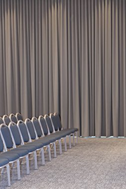 Empty blue chairs in conference hall - presentation room clipart