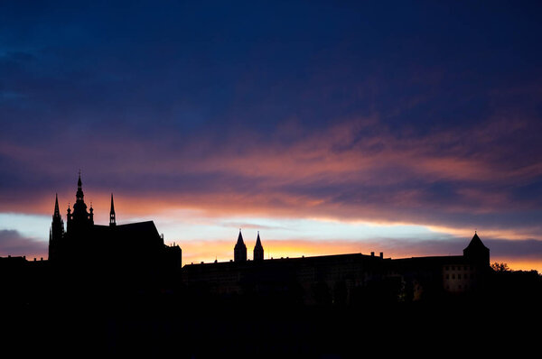 Black city silhouette against colorful sunset sky. Prague, Czesh Republic
