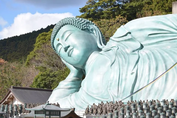 Close view of bronze statue of reclining Buddha statue at Nanzoin Temple in Sasaguri, Fukuoka, Japan