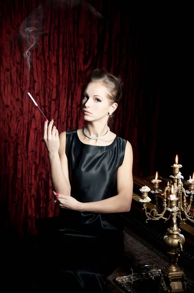 Young Elegant Woman Smoking Vintage Candlestick Burning Candles — Stock Photo, Image