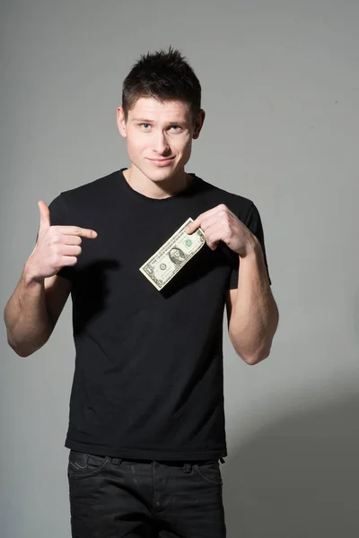 Retrato Joven Camiseta Negra Sosteniendo Dólar Sobre Fondo Gris —  Fotos de Stock