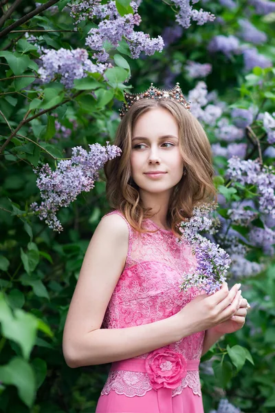 Woman, russian model in spring lilac park