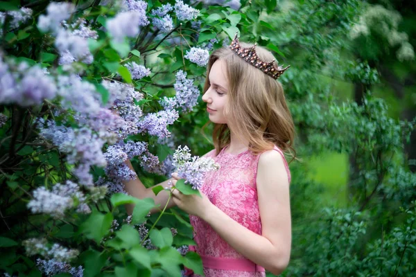 Woman, russian model in spring lilac park