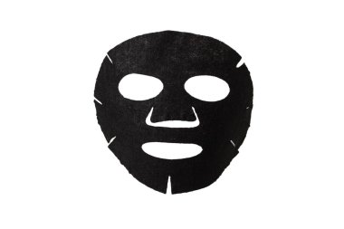 Kumaştan yapılmış yüz maskesi. Yüz derisi için siyah maske. Beyaz arka planda. Kozmetoloji, tıp ve sağlık hizmetleri.. 