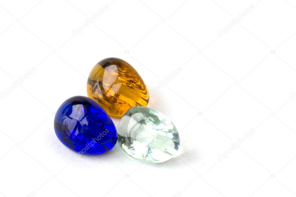 Color glass balls , blue, white, orange. White background.