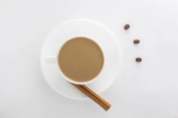 White cup of hot coffee and Cinnamon sticks . — Stock Photo, Image