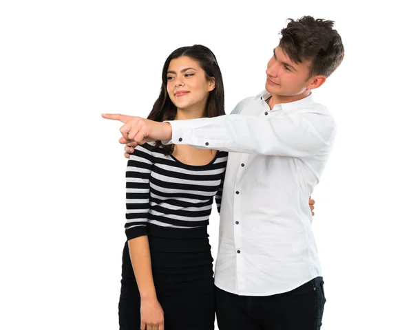 Pareja Joven Señalando Con Dedo Hacia Lado Presentando Producto Sobre —  Fotos de Stock