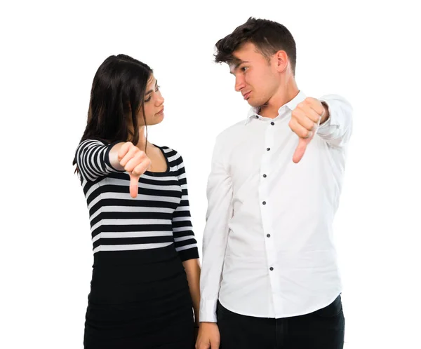 Young Couple Showing Thumb Sign Negative Expression Isolated White Background — Stock Photo, Image