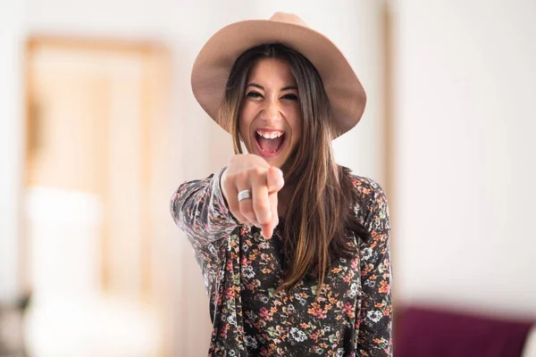 Cute woman pointing to the front