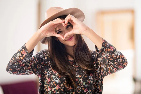 Woman making a heart with her hands