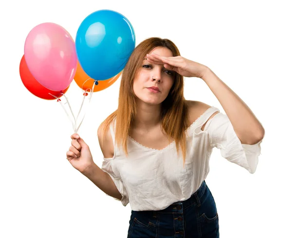 Beautiful Young Girl Holding Balloon Showing Something Stock Photo