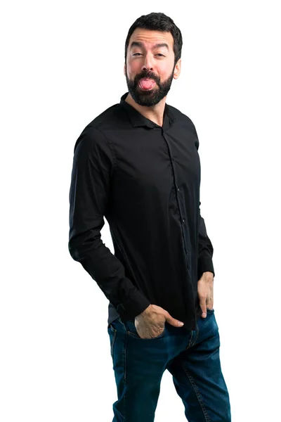 Hombre Guapo Con Barba Sacando Lengua Sobre Fondo Blanco — Foto de Stock