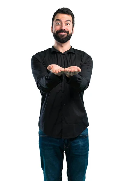 Bonito Homem Com Barba Segurando Algo Fundo Branco — Fotografia de Stock