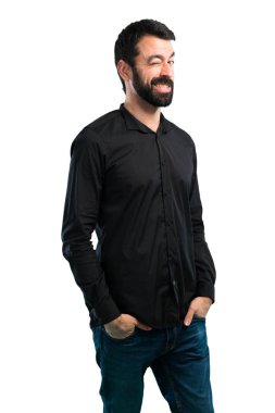 Sakalı beyaz arka plan üzerinde göz kırpıyor ile yakışıklı adam