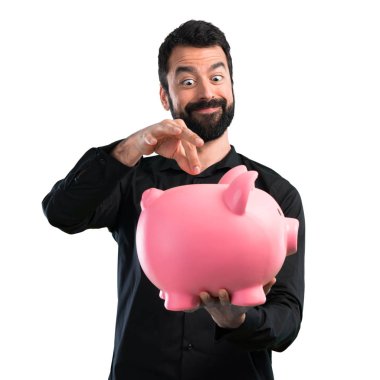 Beyaz zemin üzerinde bir servet tutan sakallı yakışıklı adam