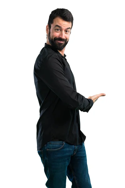 Schöner Mann Mit Bart Präsentiert Etwas Auf Weißem Hintergrund — Stockfoto