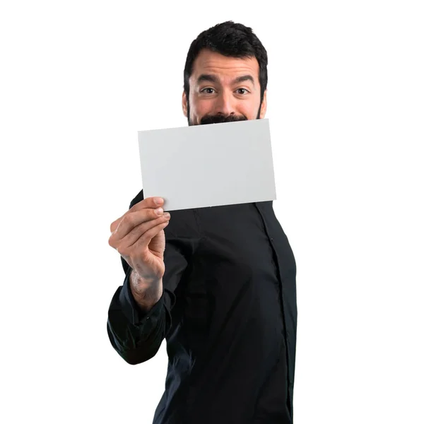 Pohledný Muž Plnovousem Drží Prázdné Cedulky Bílém Pozadí — Stock fotografie