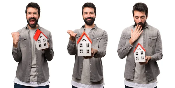 Conjunto Hombre Guapo Con Barba Sosteniendo Una Casita —  Fotos de Stock