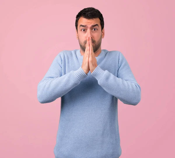 Man Blue Sweater Keeps Palm Together Person Asks Something Pink — Stock Photo, Image