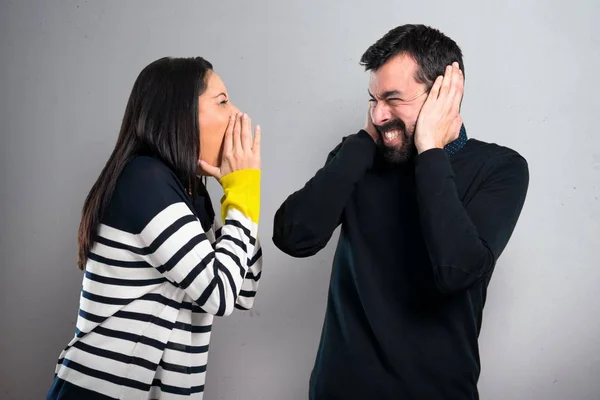 Woman Shouting Her Boyfriend Grey Background — Stock Photo, Image