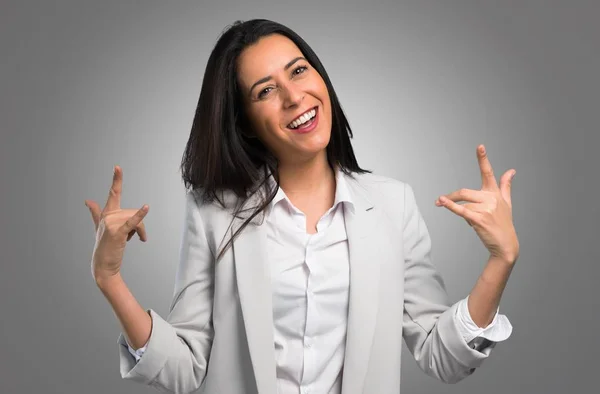 Pretty Woman Making Rock Gesture Grey Background — Stock Photo, Image